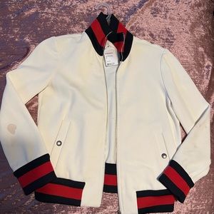 Gucci jacket with stains you can take it to the cleaners.